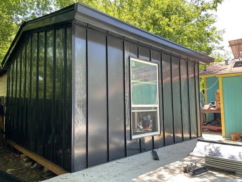 Black standing seam metal wall panels for Roof Inspection in Hillsboro