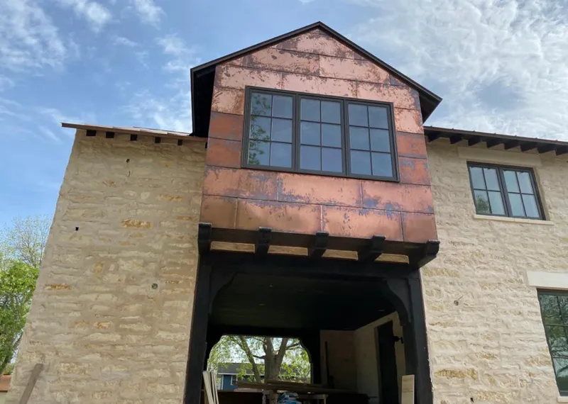 Copper metal panel facade on a stone building for Metal Roof Coating in Hillsboro